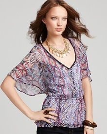 Ethereal flutter sleeves and a dynamic print makes this Ella Moss Top unique.