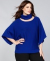 Get two sweaters in one with INC's plus size kimono-sleeve pullover. The turtleneck buttons off for a customizable look.