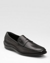 An elegant penny loafer style is crafted in Italy with a smooth leather finish and fine attention to detail. Leather lining Padded insole Rubber sole Made in Italy 