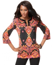 Bugle beads add shine to a richly-colored, printed tunic from INC. The flattering, wrinkle-resistant jersey fabric makes this a great choice for everyday wear.