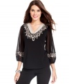 Sheer sleeves and beautiful embroidery elevate this new top from Alfani.