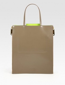 An incredibly sleek leather carryall with expandable zip gussets for extra room.Double top handles, 7 dropThree inner compartmentsThree inner open pocketsRemovable zip-pouch12¾W X 15¼H X 1/2DMade in Italy