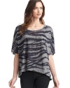 THE LOOKScoop necklinePullover styleShort dolman sleevesFront zebra print with solid contrast backAsymmetrical hemLeft vented hemTHE FITLoose fit silhouetteAbout 29 from shoulder to longest point of hemTHE MATERIALPolyesterCARE & ORIGINMachine washImported