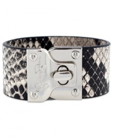 Lock up chic seasonal style! Jessica Simpson's exotic turnlock cuff bracelet features python-printed leather and silver tone mixed metal. Approximate length: 8 inches.