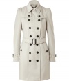 With a vintage-inspired cut, this luxe coat from Burberry London adds instant style to your cold weather look - Spread collar, long puff sleeves with belted cuffs, front button placket, double-breasted, button flap detail at shoulders - Belted waist, flap pockets, buttoned back yoke, back vent - Wear with an elevated jeans-and-tee ensemble or a cocktail look