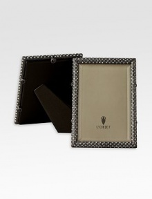 A richly detailed, oxidized platinum frame is hand-embellished with faceted Swarovski crystals. From the Noir Collection Accommodates a 4 X 6 photograph Hand wipe Imported A richly detailed, oxidized platinum frame is hand-embellished with faceted Swarovski crystals. From the Noir Collection Accommodates a 4 X 6 photograph Hand wipe Imported