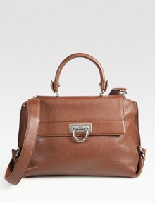 A structured frame-top design of luxe pebble-grain leather with a versatile strap and signature hardware. Top handle, 4¾ dropAdjustable detachable shoulder strap, 18¼-20½ dropToggle closure on front flapProtective metal feetOne inside zip pocketTwo inside open pocketsFully lined13¾W X 9¼H X 6DMade in Italy A structured frame-top design of luxe pebble-grain leather with a versatile strap and signature hardware. Top handle, 4¾ dropAdjustable detachable shoulder strap, 18¼-20½ dropToggle closure on front flapProtective metal feetOne inside zip pocketTwo inside open pocketsFully lined13¾W X 9¼H X 6DMade in Italy