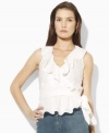 Designed in a flattering wrap silhouette from slightly sheer cotton voile, the sleeveless blouse exudes vintage charm with an elegant striped pattern and soft ruffles, from Lauren Jeans Co.