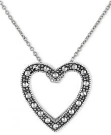 Romantic accent. You'll simply adore Genevieve & Grace's pretty open-cut heart pendant with its glittering marcasite surface. Set in sterling silver. Approximate length: 18 inches. Approximate drop: 1 inch. Romantic accent. You'll simply adore Genevieve & Grace's pretty open-cut heart pendant with its glittering marcasite surface. Set in sterling silver. Approximate length: 18 inches. Approximate drop: 1 inch.