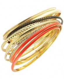 Wear them one at a time, or layer it up for an ultra-chic bohemian look. INC International Concepts' breezy bangle set mixes perfectly with warm-weather attire. 12 bangle set crafted in gold tone mixed metal and coral enamel. Approximate diameter: 2-5/8 inches.