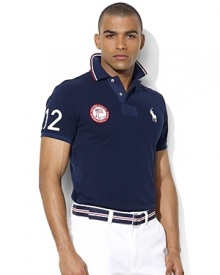 A trim-fitting short-sleeved polo shirt is rendered in breathable cotton mesh with bold country embroidery, celebrating Team USA's participation in the 2012 Paralympic Games. A trim-fitting short-sleeved polo shirt is rendered in breathable cotton mesh with bold country embroidery, celebrating Team USA's participation in the 2012 Paralympic Games.