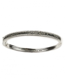 Turn your look from drab to dramatic with a flip of the wrist. This elegant bangle by Judith Jack features sparkling crystals and marcasite set in smooth sterling silver. Approximate diameter: 2-1/2 inches.