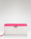 DIANE von FURSTENBERG's python-embossed leather wallet is an everyday extra with a bright side. Go bold--this zip around style is too fabulous to hide inside your bag.
