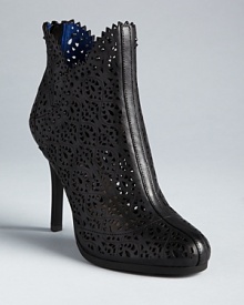 Lace-like laser cutouts and studs add textural interest to Juicy Couture's platform booties.