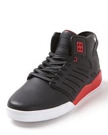 A lean, mid-top sneaker rendered in full-grain leather with bold color block accents and engineered side panels. A lean, mid-top sneaker rendered in full-grain leather with bold color block accents and engineered side panels.