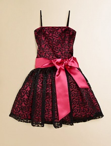 She'll be simply stunning in this lace frock with a princess-like full skirt and fancy ribbon tie.Straight necklineSpaghetti strapsBack zipperWaistband with ribbon tieFull skirtPolyesterDry cleanImported of domestic fabric She'll be simply stunning in this lace frock with a princess-like full skirt and fancy ribbon tie.Straight necklineSpaghetti strapsBack zipperWaistband with ribbon tieFull skirtPolyesterDry cleanImported of domestic fabric