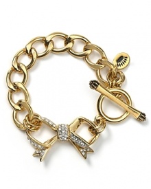 Juicy Couture takes their cult favorite starter bracelet in a dainty direction with a new pavé bow pendant.