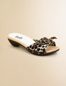 Clog style slides with a contour sole and knotted fabric print fabric.Cotton tie upperSide stud detailContour molded soleMade in Italy Clog style slides with a contour sole and knotted fabric print fabric.Cotton tie upperSide stud detailContour molded soleMade in Italy