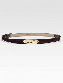 A soft suede style with leather accents and signature goldtone hardware. Width, about .75Made in Italy A soft suede style with leather accents and signature goldtone hardware. Width, about .75Made in Italy