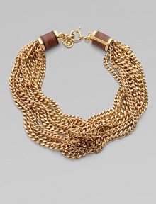 This chunky style is enhanced by croc-print leather inlay barrel caps. Brass Length, about 19 Lobster clasp closure with logo lock Imported This chunky style is enhanced by croc-print leather inlay barrel caps. Brass Length, about 19 Lobster clasp closure with logo lock Imported