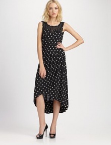 Gorgeous silk jersey tailored with retro-flare in this ultra-feminine silhouette, finished in a perky dotted print.Jewel necklineSleevelessSet-in waistGathered pleats at waistCrossover skirtHem longer in backBack pleats at waistCenter back zipperAbout 32 from natural waist60% silk/40% modalDry cleanImported