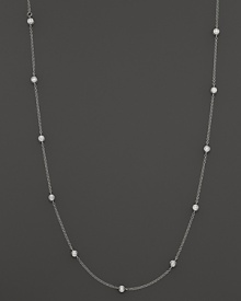 Diamond stations shine on an elegant white gold necklace. Diamond stations shine on an elegant white gold necklace.