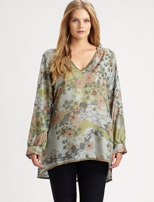 A spellbinding floral print meets luxurious silk fabrication to create a beautiful pullover tunic. Its feminine neckline perfectly complements your decolletage. V-neckLong sleevesButton cuffsPull-on styleEmbroidered hemBack yokeAbout 31 from shoulder to hemSilkHand washImported