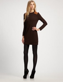 Sturdy, ultra-flattering stretch knit, accented with chic leather shoulder details.Jewel necklineLong sleevesLeather shoulder patchesBanded hemlineConcealed back zipAbout 17½ from natural waist65% rayon/30% nylon/5% spandexDry cleanMade in USA of imported fabricOUR FIT MODEL RECOMMENDS ordering true size. 