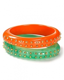 Add a vibrant pop of color to your look with Kenneth Jay Lane's bright studded bangle.