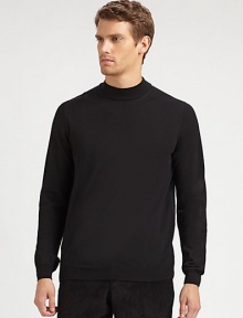 A sophisticated layer with a ribbed mockneck collar in soft merino wool.Ribbed mockneck collarLong sleeves with ribbed cuffsRibbed hemMerino woolDry cleanImported