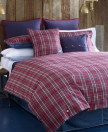 Finished with decorative plaid buttons on navy cotton canvas, this decorative pillow from Tommy Hilfiger is the ideal complement to the Bear Mountain bedding collection. Button closure.