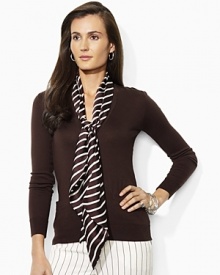 The classic V-neck cardigan is updated with a detachable silk scarf at the neckline for a chic accent.