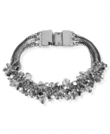 Banded together for eclectic elegance, Kenneth Cole New York offers this multi-chain bracelet. It's crafted from silver-tone mixed metal and features faceted bead accents. Approximate length: 7-1/2 inches.