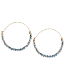 Tiny beads make a big statement on this pair of hoop earrings from Kenneth Cole New York. The silver and blue cherry beads adorn the earrings crafted from gold-tone mixed metal for a stunning look. Approximate drop: 2-1/4 inches. Tiny beads make a big statement on this pair of hoop earrings from Kenneth Cole New York. The silver and blue cherry beads adorn the earrings crafted from gold-tone mixed metal for a stunning look. Approximate drop: 2-1/4 inches.