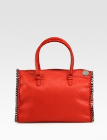 Sumptuous faux leather in a wide, top-handle silhouette, edged with silvertone chains.Double top handles, 6½ dropTop zip closureOne inside zip pocketOne inside open pocketFully lined15W X 11¼H X 7½DMade in Italy Sumptuous faux leather in a wide, top-handle silhouette, edged with silvertone chains.Double top handles, 6½ dropTop zip closureOne inside zip pocketOne inside open pocketFully lined15W X 11¼H X 7½DMade in Italy