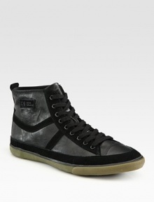 Sporty design with an edgy, downtown attitude in tonal leather and suede.Leather liningPadded insoleRubber soleImported