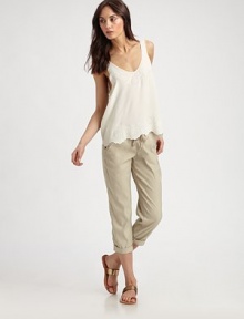 Wear-with-anything silk v-neck has a scalloped hem, v-back and intricate perforations. V-neckSleevelessScalloped hemV-backSilkDry cleanImportedModel shown is 5'10 (177cm) wearing US size Small.