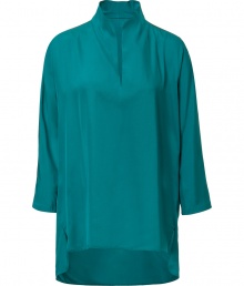 Elegant top in fine, turquoise acetate and silk blend - Luxe, lightweight fabric drapes like a dream - Chic tunic cut with small stand up collar, key hole neckline and on-trend, 3/4 sleeves - Slits at sides, hem hangs slightly lower in the back - Longer, relaxed silhouette - Easy and polished, seamlessly transitions form work to weekend - pair with cigarette pants, skinny denim, dressy shorts and pencil skirts