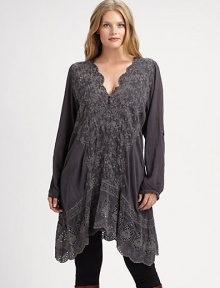 Elegant embroidery and a feminine scalloped neckline come together to create a tunic you will not want to take off.Scalloped necklineLong sleevesEmbroidered detailsHandkerchief hemAbout 38 from shoulder to hemRayonMachine washImported