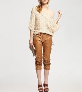 This lightweight design is enhanced by a versatile neckline that can be worn off-the-shoulder for a skin-baring look. BoatneckDropped shouldersThree-quarter length dolman sleevesAllover semi-sheer macrame knitAbout 30 from shoulder to hem73% acrylic/27% nylonDry cleanImportedModel shown is 5'9½ (176cm) wearing US size Small.