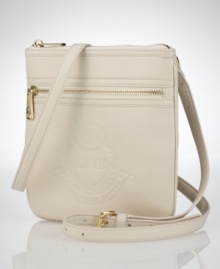 Rich, pebbled leather is handcrafted into a compact shape with an embossed signature crest, adding an authentic heritage touch to this Lauren by Ralph Lauren crossbody design. Rich, pebbled leather is handcrafted into a compact shape with an embossed signature crest, adding an authentic heritage touch to this Lauren by Ralph Lauren crossbody design.