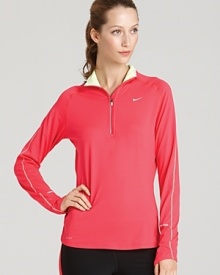 Made with Dri-FIT technology to wick away moisture, pull on this Nike top for travel to and from the gym or for a weekend outdoor run.