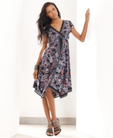 A vibrant paisley print and handkerchief hem lend an exotic look to INC's easy petite dress.