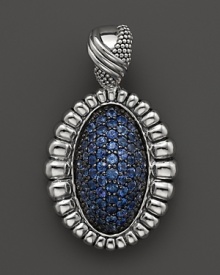 Shining blue sapphires are trimmed in fluted sterling silver on this Lagos pendant. Shining blue sapphires are trimmed in fluted sterling silver on this Lagos pendant.