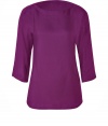 Understated, feminine style is yours with this purple tunic of pure, textured silk - Narrow waist with wide, round neck and 3/4-length sleeves - Cut is slightly longer at back and front - Favorite top for business with black suit pants and peep toe heels, or for an evening out with leather pants, tube skirts or skinny jeans and sandals