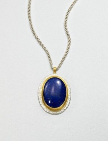 A beautiful, speckled lapis cabochon set in sterling silver and 24k gold on a link chain. LapisSterling silver24k goldLength, about 17.7Pendant size, about 1.2Lobster clasp closureImported A beautiful, speckled lapis cabochon set in sterling silver and 24k gold on a link chain. LapisSterling silver24k goldLength, about 17.7Pendant size, about 1.2Lobster clasp closureImported