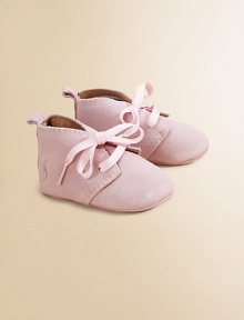 Adorable baby booties crafted in ultra-plush suede in a lace-up silhouette.Ribbon tieSuede upperLeather liningLeather solePadded insoleImported Adorable baby booties crafted in ultra-plush suede in a lace-up silhouette.Ribbon tieSuede upperLeather liningLeather solePadded insoleImported