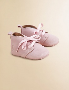 Adorable baby booties crafted in ultra-plush suede in a lace-up silhouette.Ribbon tieSuede upperLeather liningLeather solePadded insoleImported