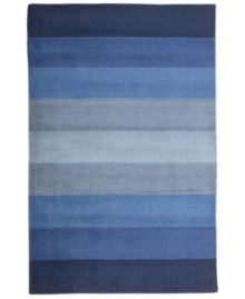 Hand-tufted, blended wool gives an exceptionally soft feel to this rug from the Coastal Treasures collection. In a shimmering, striped design of ocean-blue colorways, this sophisticated piece adds serene character to every decor.