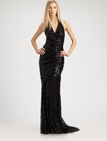 Shimmering allover sequins lend a dazzling effect to this floor-length, lace halter style.Surplice halter neckline with hook-and-eye closureGathers at waistLow backBack trainConcealed back zipSilk liningAbout 45 from natural waistPolyesterDry cleanImportedModel shown is 5'10 (177cm) wearing US size 4. Shimmering allover sequins lend a dazzling effect to this floor-length, lace halter style.Surplice halter neckline with hook-and-eye closureGathers at waistLow backBack trainConcealed back zipSilk liningAbout 45 from natural waistPolyesterDry cleanImportedModel shown is 5'10 (177cm) wearing US size 4.